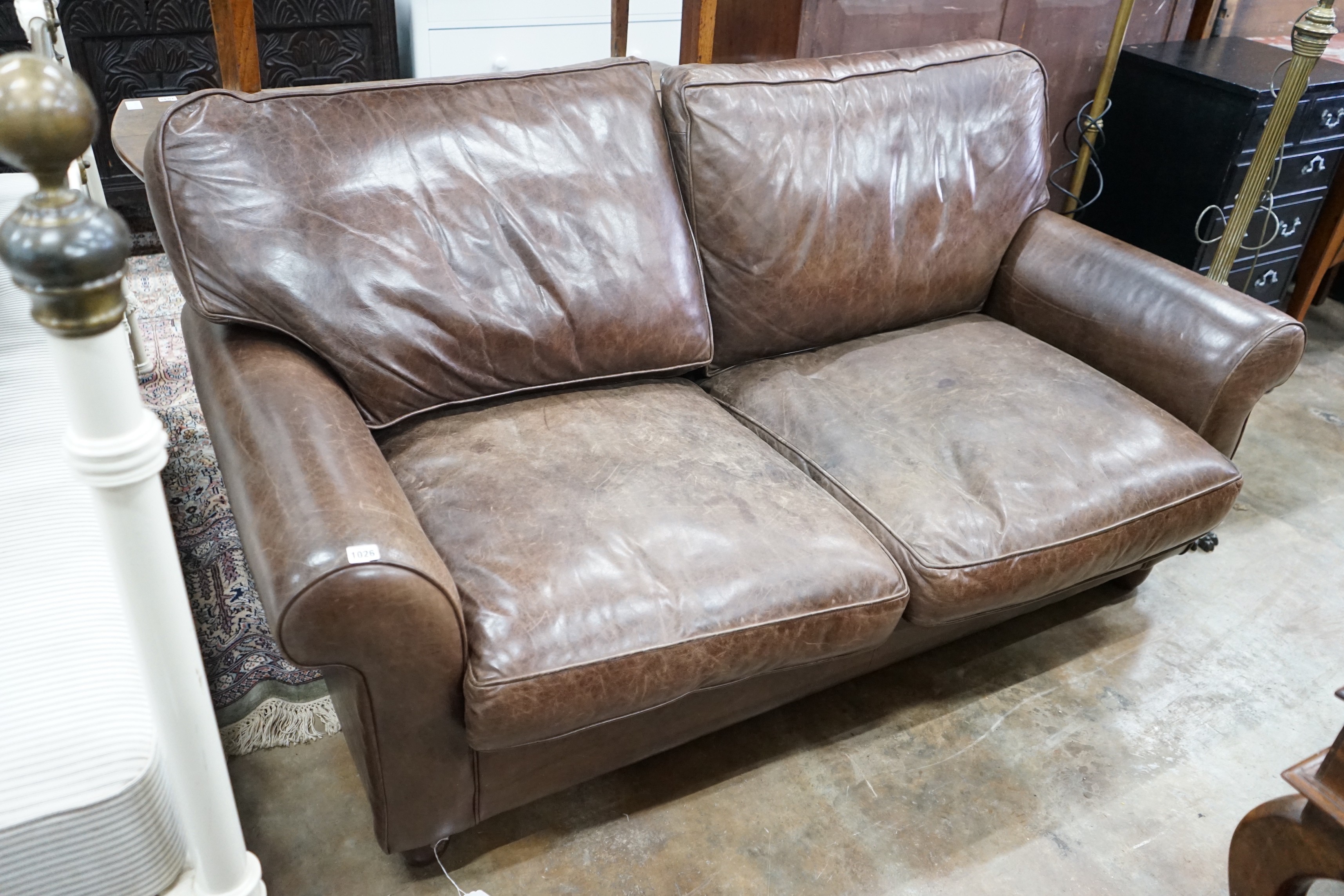 A Laura Ashley brown leather sofa bed, width 170cm, depth 96cm, height 86cm